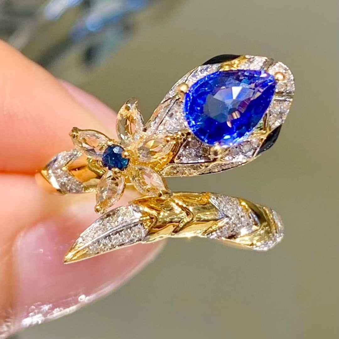 14k Gold 1.1 Ct Natural Sapphire & Diamond & Sapphire Ring: Ref:231008247 // gold content:14k gold // ring size:7. 25us // // main gemstone:sapphire // shape:pear // carat weight:1. 1ct // color:blue // treatment:natural // // adjacent gemstone 2 : diamond //