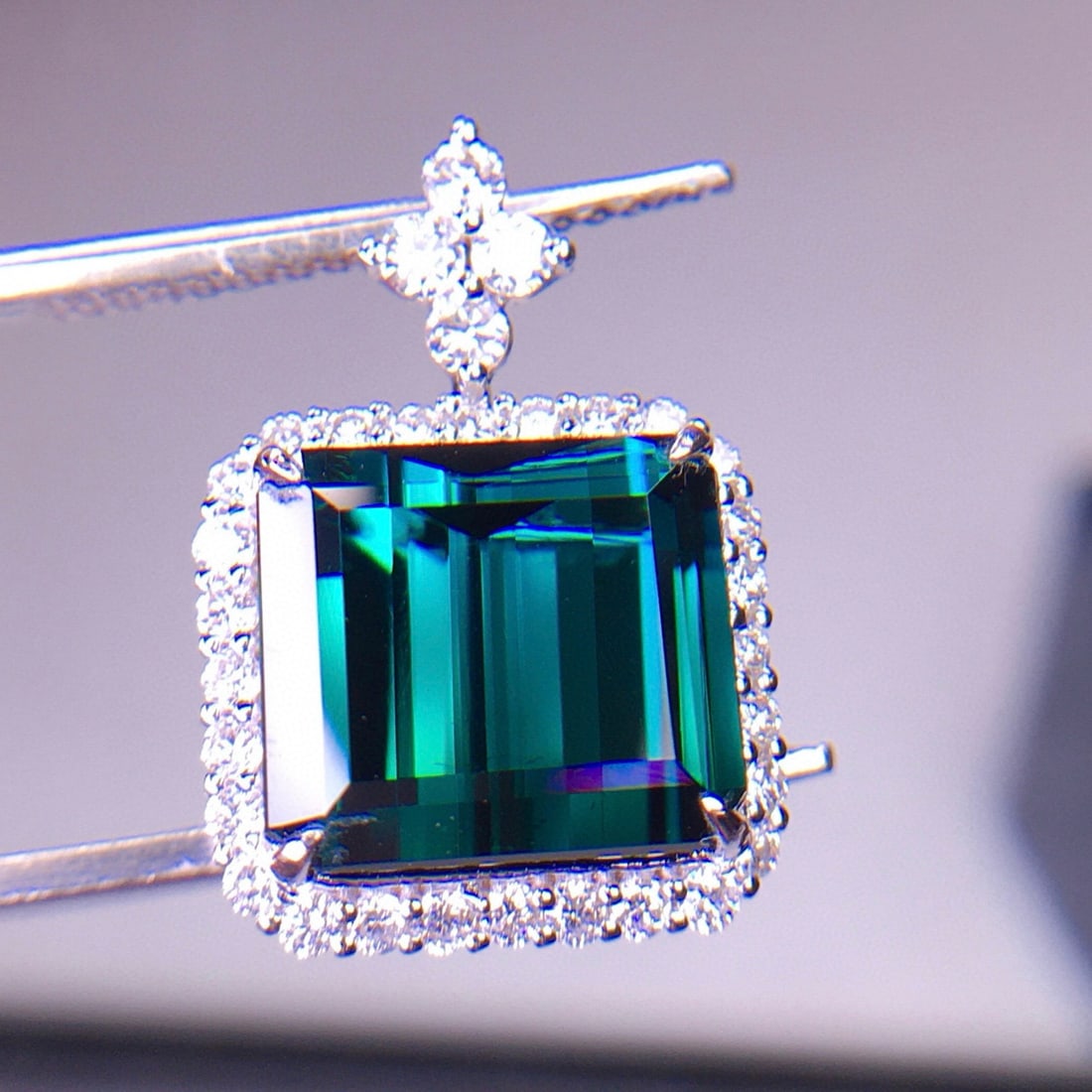 14k Gold 6.1 Ct Natural Tourmaline & Diamond Pendant( Without Chain ): Ref:231008287 // gold content:14k gold // main gemstone:tourmaline // shape:octagonal // carat weight:6. 1ct // color:blue // treatment:natural // // adjacent gemstone 2 : diamond // shape:round //