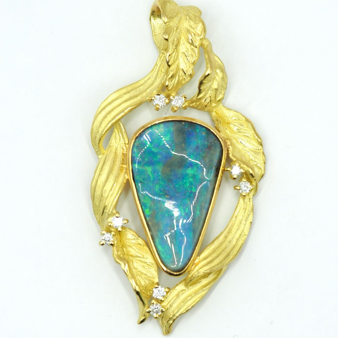 14k Gold 6.73 Ctw Natural Opal & Diamond Pendant( Without Chain ): Ref:231008314 // gold content:14k gold // main gemstone:opal // shape:pear // carat weight:6. 58ct // color:color // treatment:natural // // adjacent gemstone 2 : diamond // shape:round // carat weigh