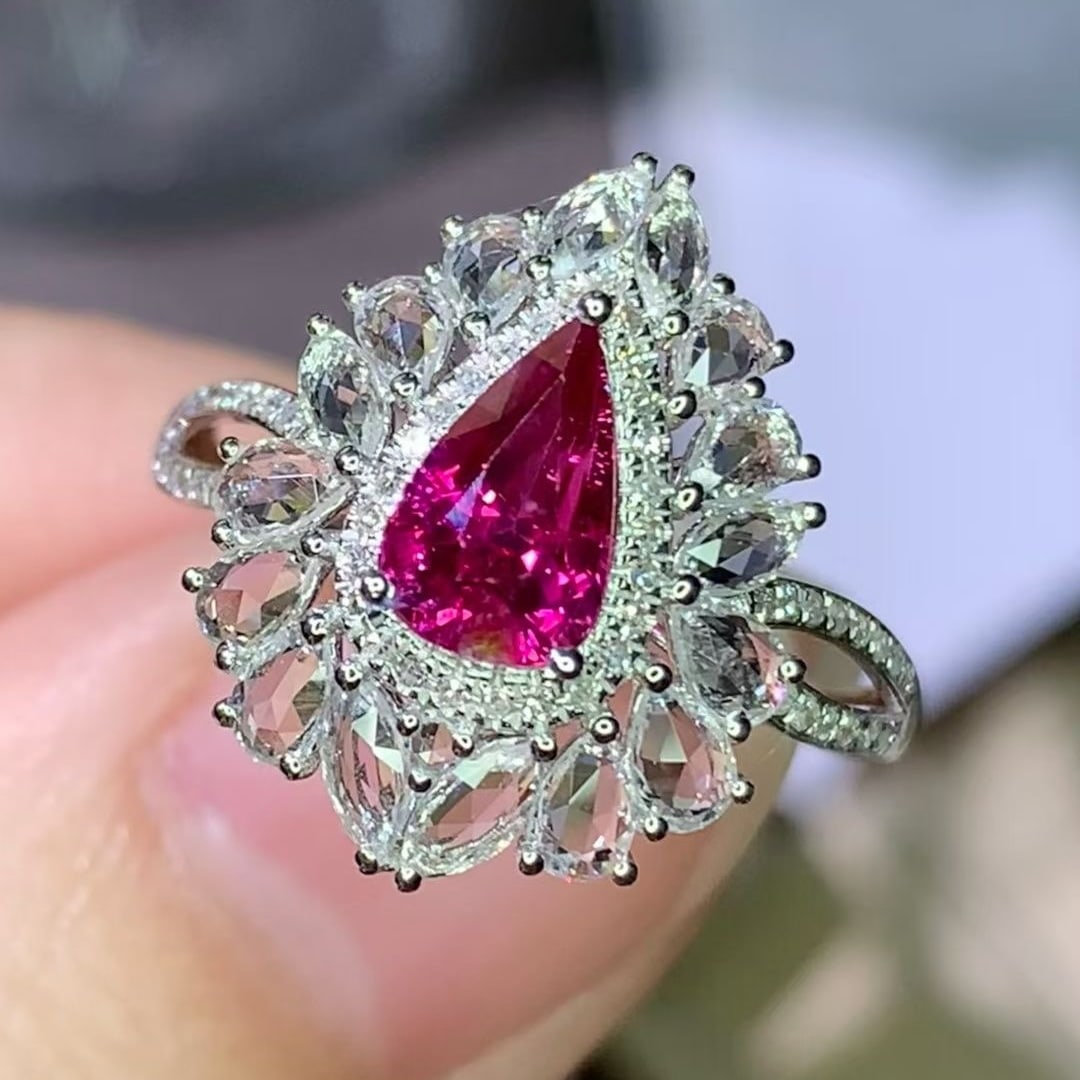 14k Gold 1.02 Ct Natural Ruby & Diamond & Sapphire Ring: Ref:231008337 // gold content:14k gold // ring size:7. 25us // // main gemstone:ruby // shape:pear // carat weight:1. 02ct // color:red // treatment:natural // // adjacent gemstone 2 : diamond //