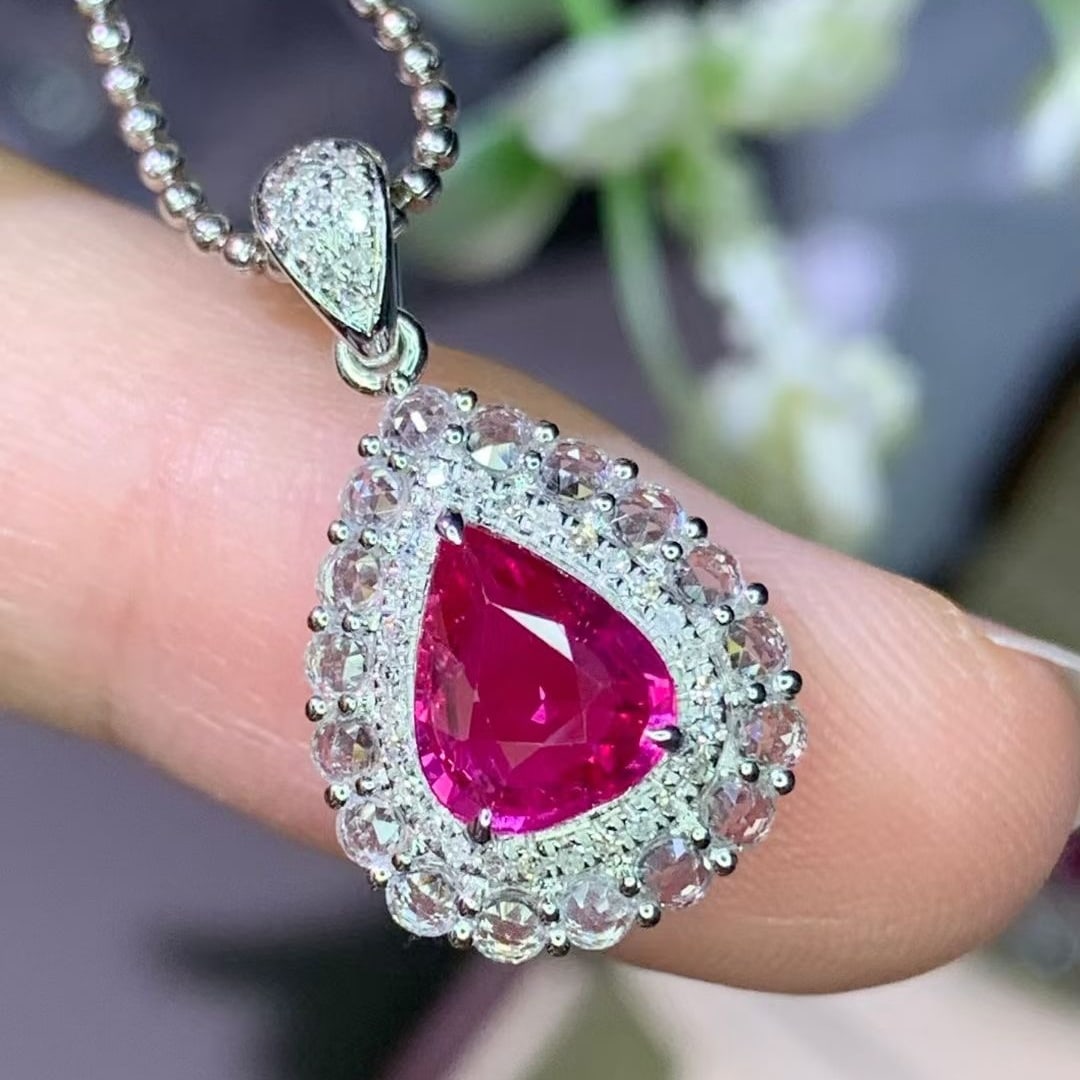 14k Gold 1.15 Ct Natural Ruby & Diamond & Sapphire Pendant( Without Chain ): Ref:231008338 // gold content:14k gold // main gemstone:ruby // shape:pear // carat weight:1. 15ct // color:red // treatment:natural // // adjacent gemstone 2 : diamond // shape:round // clarity
