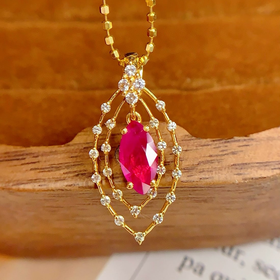 14k Gold 0.6 Ct Natural Ruby & Sapphire Pendant( Without Chain ): Ref:231008340 // gold content:14k gold // main gemstone:ruby // shape:marquise // carat weight:0. 6ct // color:red // treatment:natural // // adjacent gemstone 2 : sapphire // number of stones:26 // s