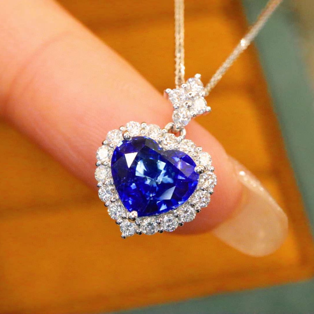 14k Gold 2.45 Ctw Natural Sapphire & Diamond Pendant( Without Chain ): Ref:231008352 // gold content:14k gold // main gemstone:sapphire // shape:heart // carat weight:2. 01ct // color:royal blue // treatment:natural // // adjacent gemstone 2 : diamond // number of stones