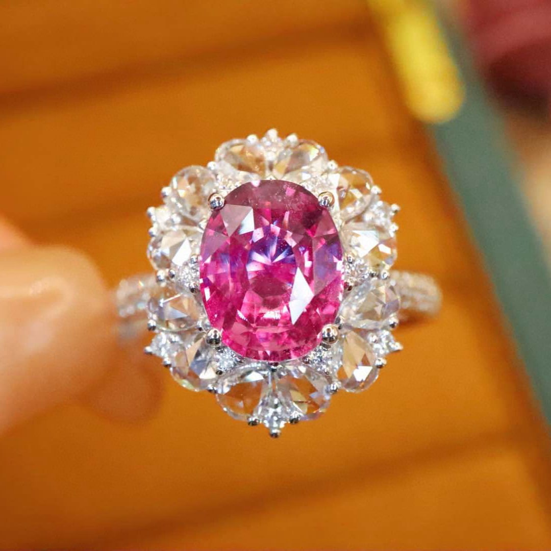 14k Gold 2.83 Ctw Natural Padparadscha Sapphire & Diamond Ring: Ref:231008375 // gold content:14k gold // ring size:7. 25us // // main gemstone:padparadscha sapphire // shape:oval // carat weight:2. 09ct // color:orangish pink // treatment:natural // // adjacent
