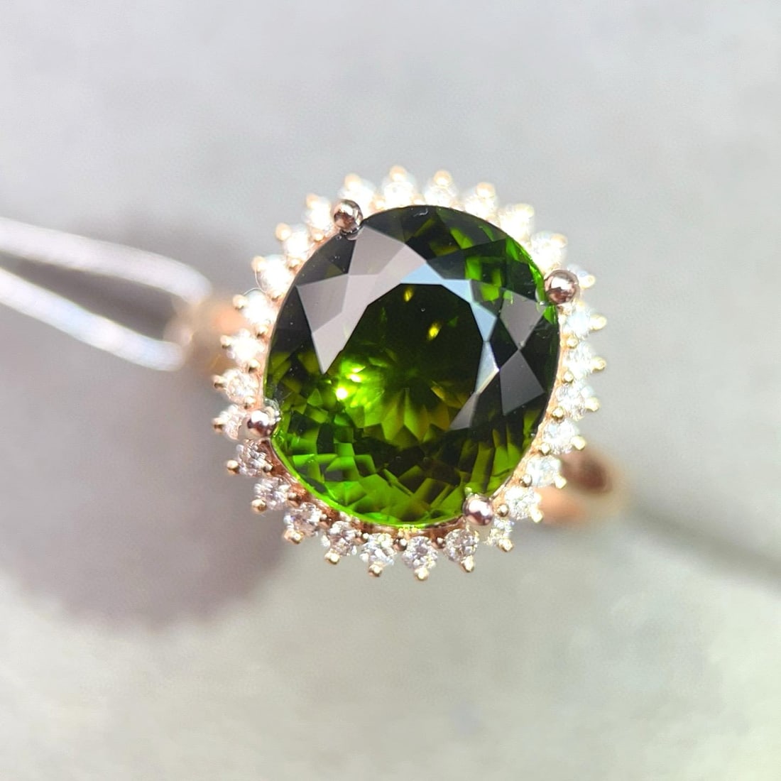 14k Gold 6.36 Ctw Natural Tourmaline & Diamond Ring: Ref:231008398 // gold content:14k gold // ring size:7. 25us // // main gemstone:tourmaline // shape:oval // carat weight:6. 08ct // color:green // treatment:natural // // adjacent gemstone 2 :