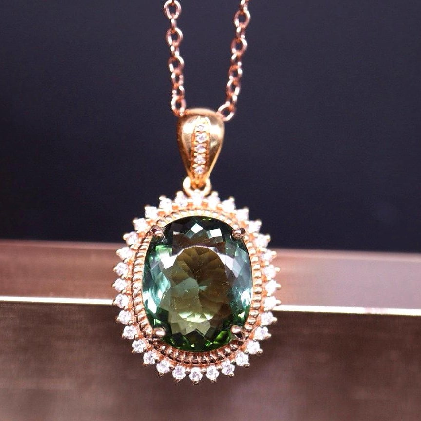 14k Gold 3.85 Ct Natural Tourmaline & Diamond Pendant( Without Chain ): Ref:231008399 // gold content:14k gold // main gemstone:tourmaline // shape:oval // carat weight:3. 85ct // color:green // treatment:natural // // adjacent gemstone 2 : diamond // number of stones:37