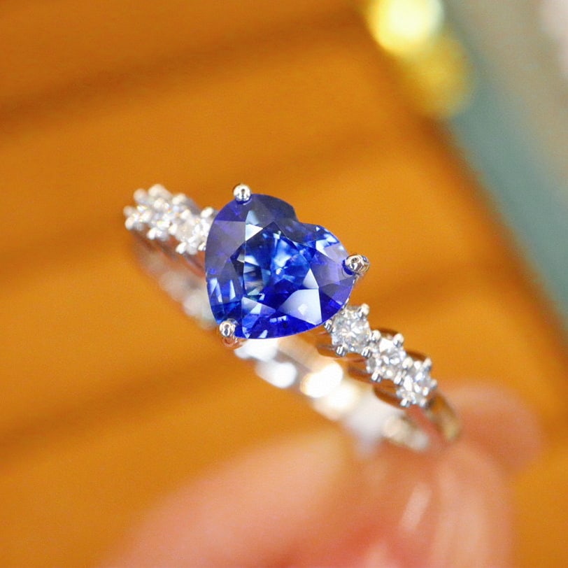 14k Gold 0.98 Ctw Natural Sapphire & Diamond Ring: Ref:231008405 // gold content:14k gold // ring size:7. 25us // // main gemstone:sapphire // shape:heart // carat weight:0. 86ct // color:royal blue // treatment:natural // // adjacent gemstone 2 :