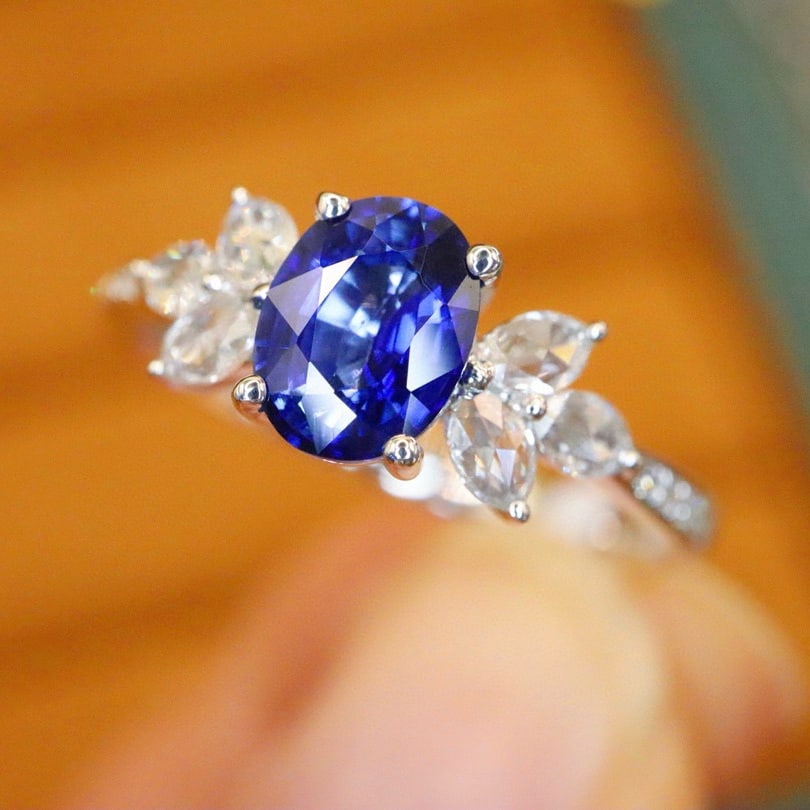 14k Gold 1.10 Ctw Natural Sapphire & Diamond Ring: Ref:231008446 // gold content:14k gold // ring size:7. 25us // // main gemstone:sapphire // shape:oval // carat weight:0. 90ct // color:royal blue // treatment:natural // // adjacent gemstone 2 :