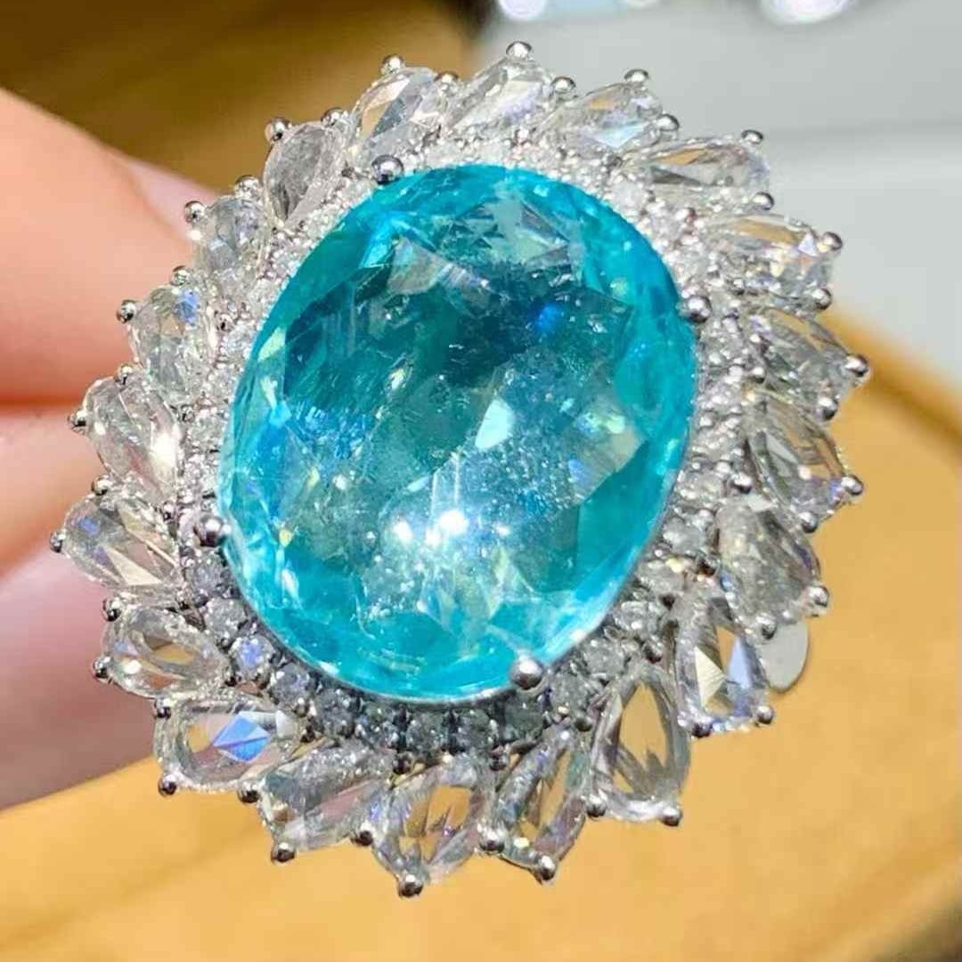 14k Gold 7.12 Ct Natural Paraiba Tourmaline & Diamond Ring: Ref:231117017 // gold content:14k gold // ring size:7. 25us // // main gemstone:paraiba tourmaline // shape:oval // carat weight:7. 12ct // color:blue // treatment:natural // // adjacent gemstone 2 :