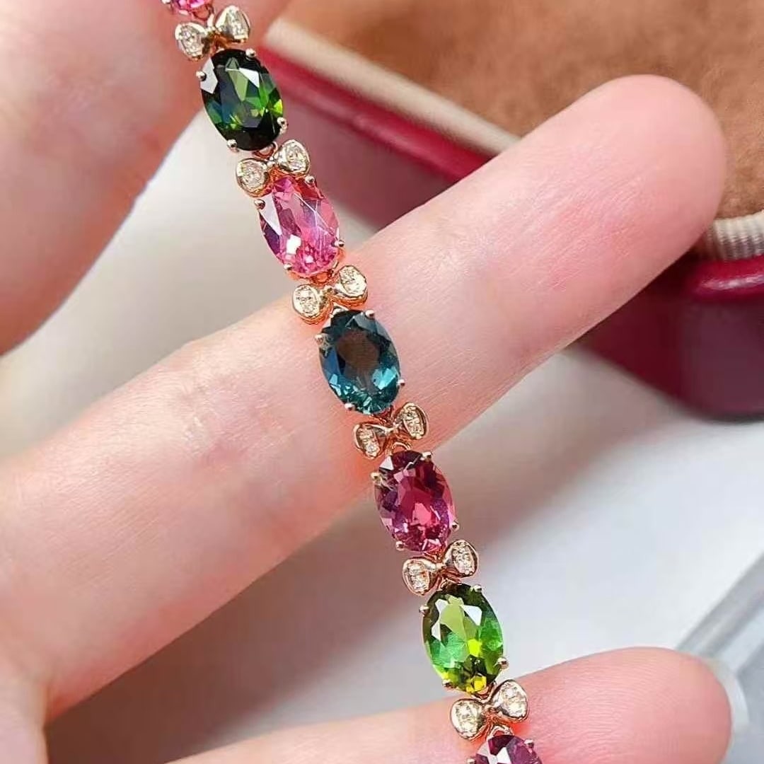 14k Gold 5 Ct Natural Tourmaline & Diamond Bracelet: Ref:231117147 // gold content:14k gold // main gemstone:tourmaline // shape:oval // carat weight:5ct // color:color // treatment:natural // // adjacent gemstone 2 : diamond // number of stones:24 // s