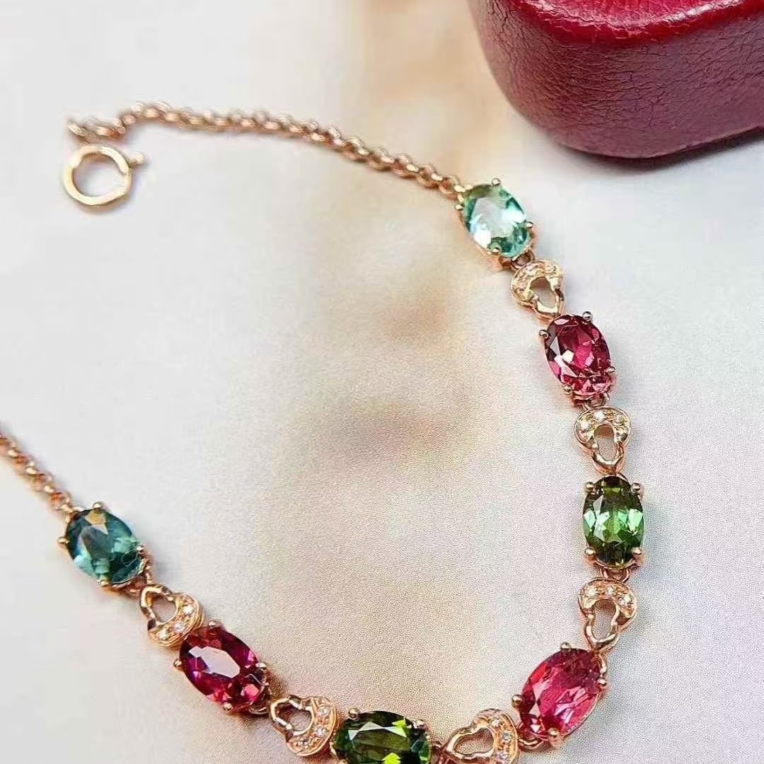 14k Gold 3 Ct Natural Tourmaline & Diamond Bracelet: Ref:231117234 // gold content:14k gold // main gemstone:tourmaline // shape:oval // carat weight:3ct // color:color // treatment:natural // // adjacent gemstone 2 : diamond // number of stones:18 // s