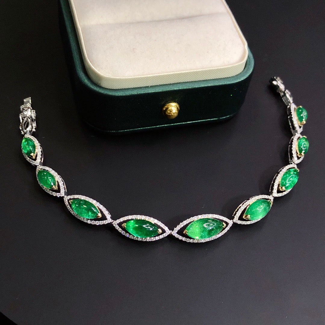 14k Gold 10.74 Ctw Vivid Green Natural Emerald & Diamond Bracelet: Ref:231118118 // gold content:14k gold // main gemstone:emerald // shape:marquise // carat weight:9. 55ct // color:vivid green // treatment:natural // // adjacent gemstone 2 : diamond // shape:round /