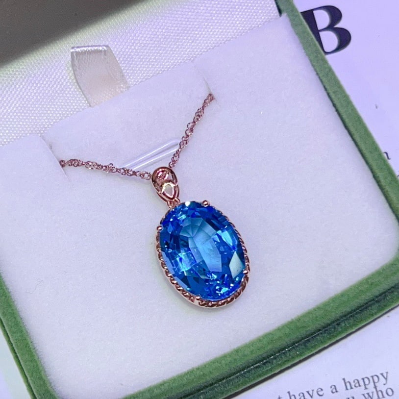 14k Gold 14.8 Ct Natural Topaz Pendant( Without Chain ): Ref:231118185 // gold content:14k gold // main gemstone:topaz // shape:oval // carat weight:14. 8ct // color:blue // treatment:natural // Condition: New Low Estimate: 2500.00 High Estimate: 3800.00