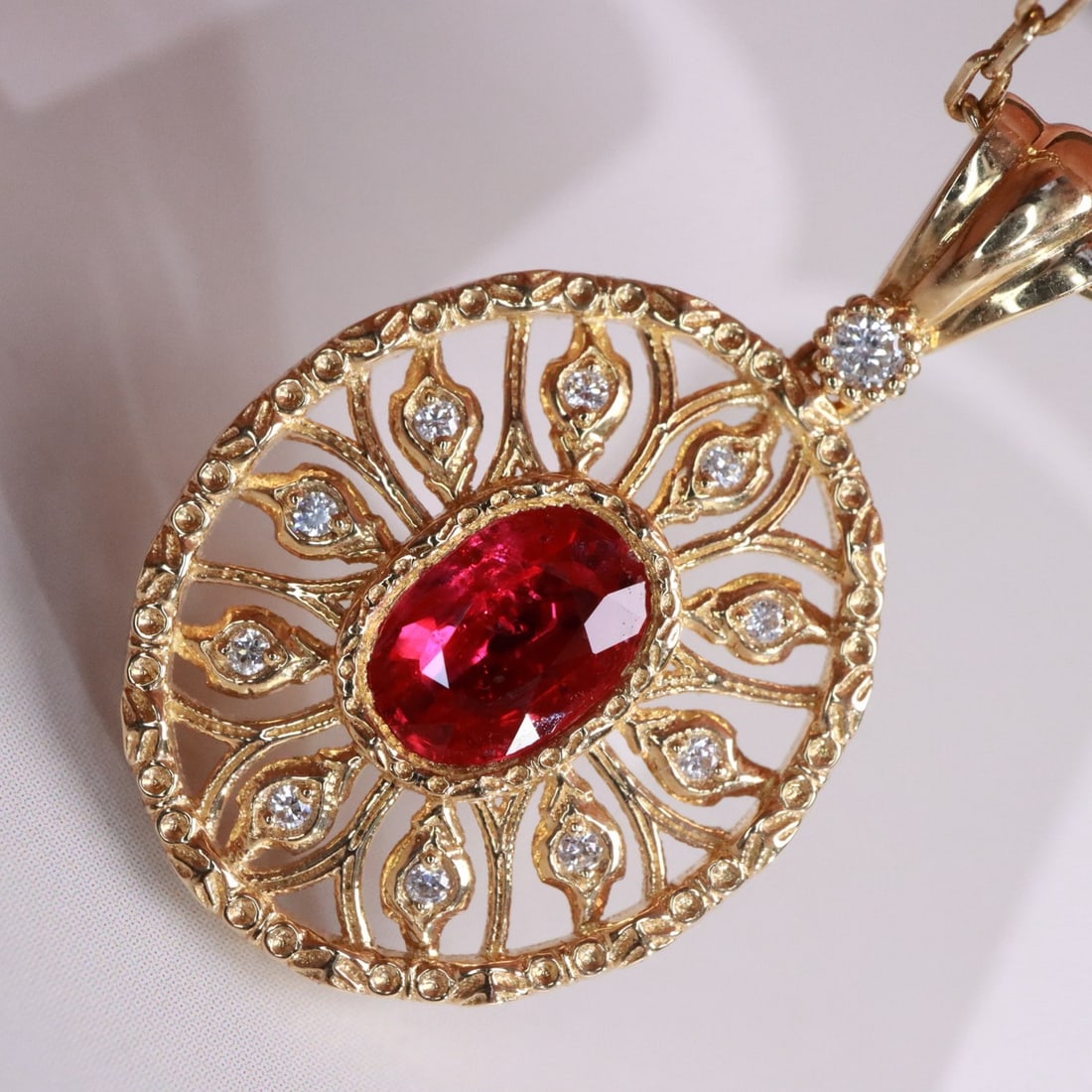14k Gold 0.80 Ctw Natural Ruby & Diamond Pendant( Without Chain ): Ref:231118308 // gold content:14k gold // main gemstone:ruby // shape:oval // carat weight:0. 73ct // color:red // treatment:natural // // adjacent gemstone 2 : diamond // shape:round // carat weight: