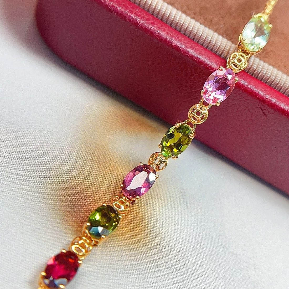 14k Gold 2.3 Ct Natural Tourmaline Bracelet: Ref:231118358 // gold content:14k gold // main gemstone:tourmaline // shape:oval // carat weight:2. 3ct // color:color // treatment:natural // Condition: New Low Estimate: 3800.00 High Estimate: