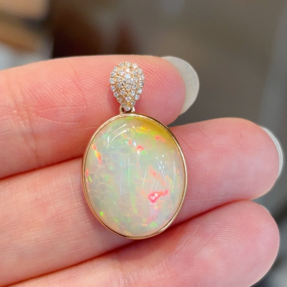 14k Gold 8.18 Ctw Natural Opal & Diamond Pendant( Without Chain ): Ref:231118393 // gold content:14k gold // main gemstone:opal // shape:oval // carat weight:8ct // color:color // treatment:natural // // adjacent gemstone 2 : diamond // shape:round // carat
