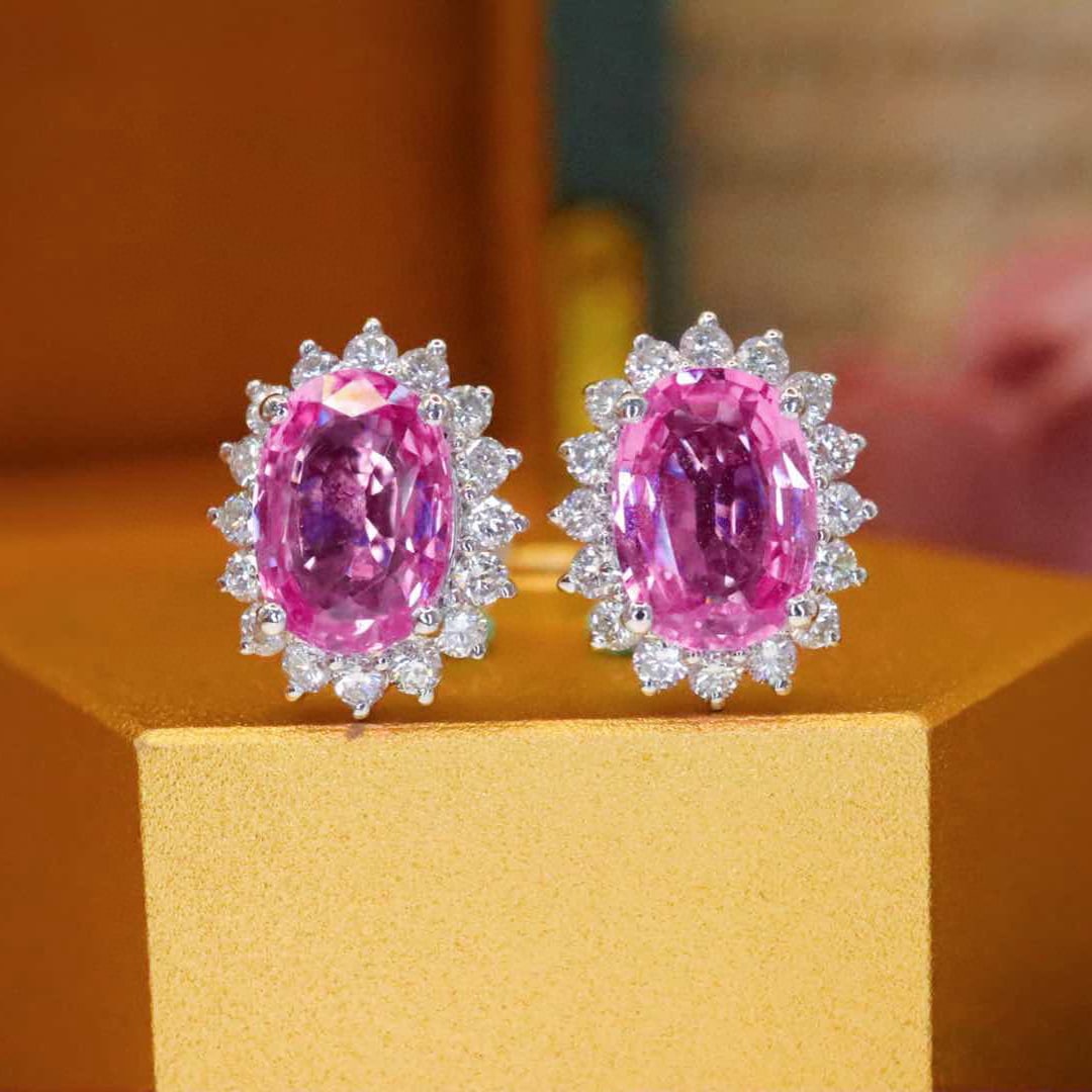14k Gold 2.33 Ctw Natural Padparadscha Sapphire & Diamond Earrings: Ref:231017041 // gold content:14k gold // main gemstone:padparadscha sapphire // shape:oval // carat weight:1. 95ct // color:orangish pink // treatment:natural // // adjacent gemstone 2 : diamond //