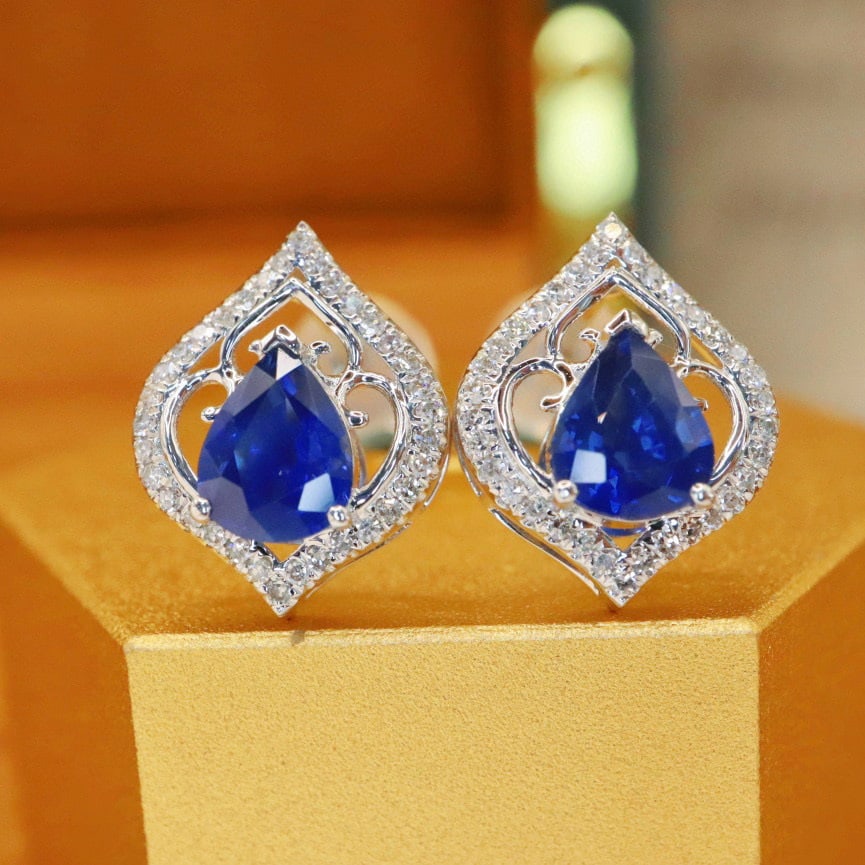 14k Gold 1.57 Ctw Natural Sapphire & Diamond Earrings: Ref:231017042 // gold content:14k gold // main gemstone:sapphire // shape:pear // carat weight:1. 37ct // color:royal blue // treatment:natural // // adjacent gemstone 2 : diamond // number of