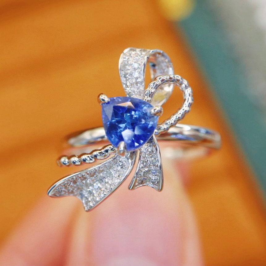 14k Gold 1.33 Ctw Natural Sapphire & Diamond Ring: Ref:231017043 // gold content:14k gold // ring size:7. 25us // // main gemstone:sapphire // shape:pear // carat weight:1. 18ct // color:cornflower blue // treatment:natural // // adjacent gemstone 2