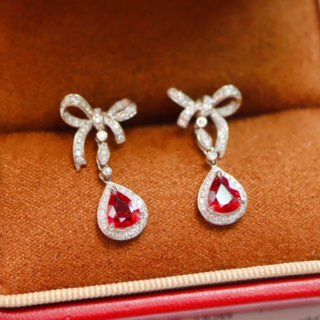 14k Gold 1.60 Ctw Natural Ruby & Diamond Earrings: Ref:231017047 // gold content:14k gold // main gemstone:ruby // shape:pear // carat weight:1. 17ct // color:pigeonblood red // treatment:natural // // adjacent gemstone 2 : diamond // shape:round // c