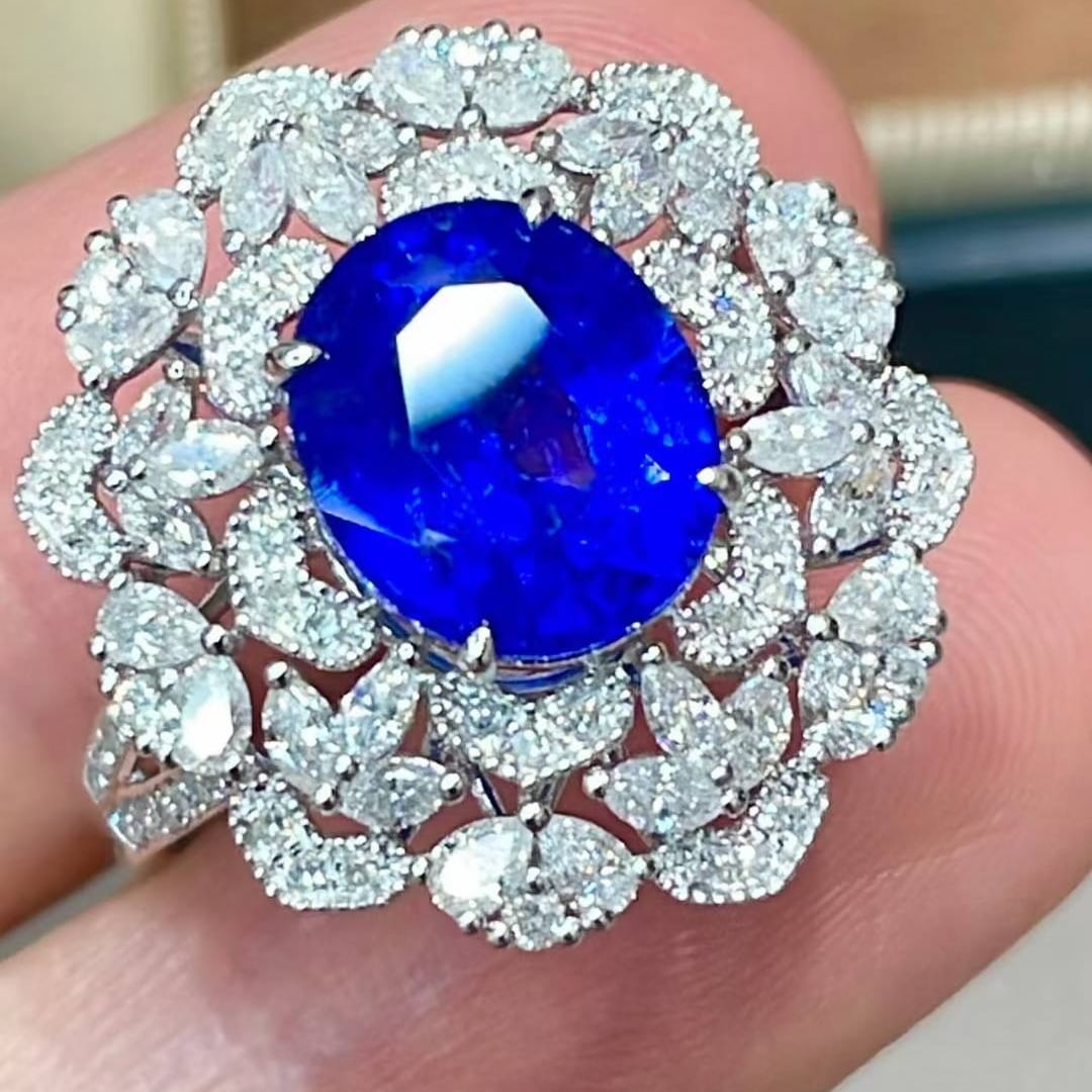 14k Gold 4.35 Ctw Natural Sapphire & Diamond Ring: Ref:231017144 // gold content:14k gold // ring size:7. 25us // // main gemstone:sapphire // shape:oval // carat weight:3. 3ct // color:royal blue // treatment:natural // // adjacent gemstone 2 : diamo