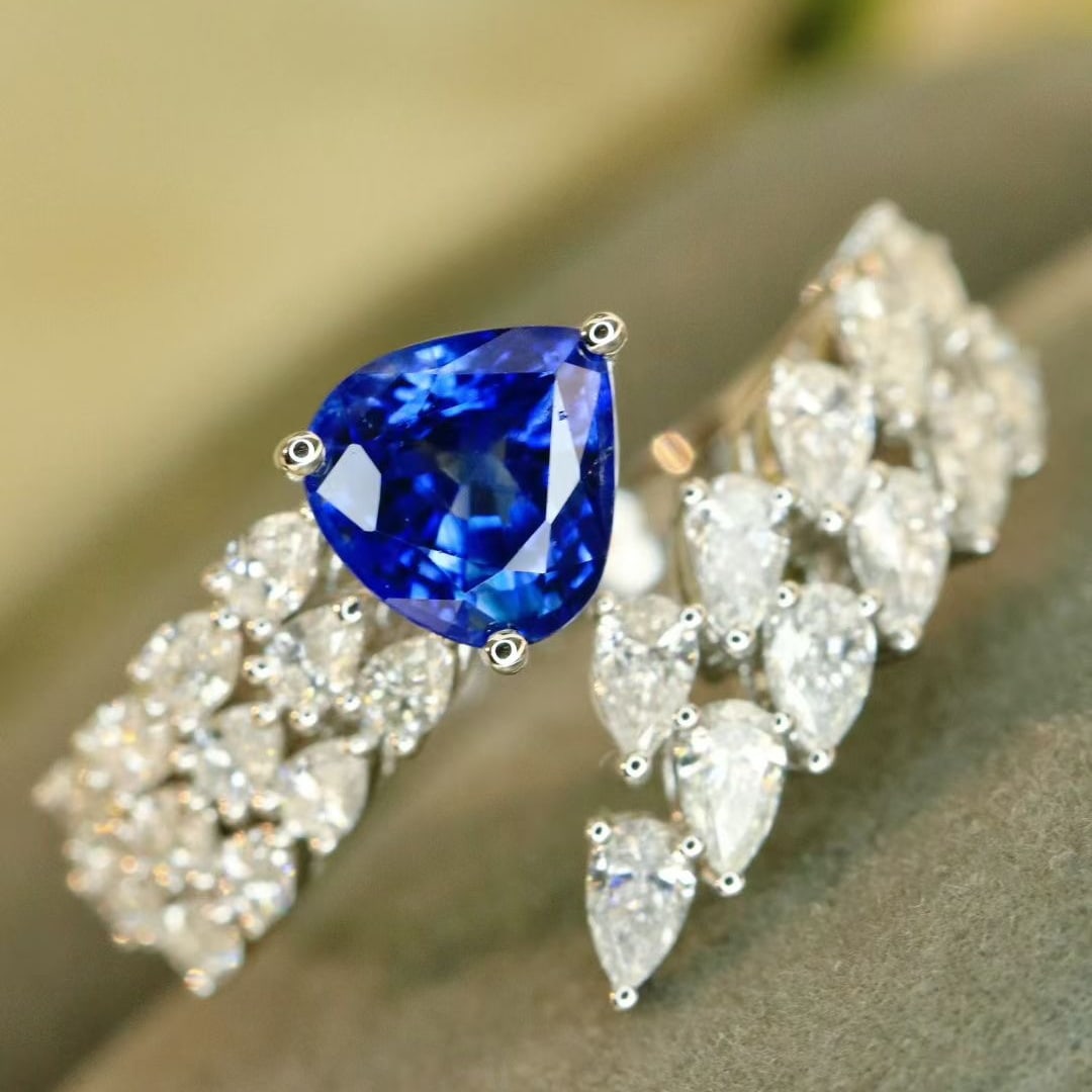 14k Gold 2.98 Ctw Natural Sapphire & Diamond Ring: Ref:231017149 // gold content:14k gold // ring size:7. 25us // // main gemstone:sapphire // shape:pear // carat weight:1. 75ct // color:cornflower blue // treatment:natural // // adjacent gemstone 2
