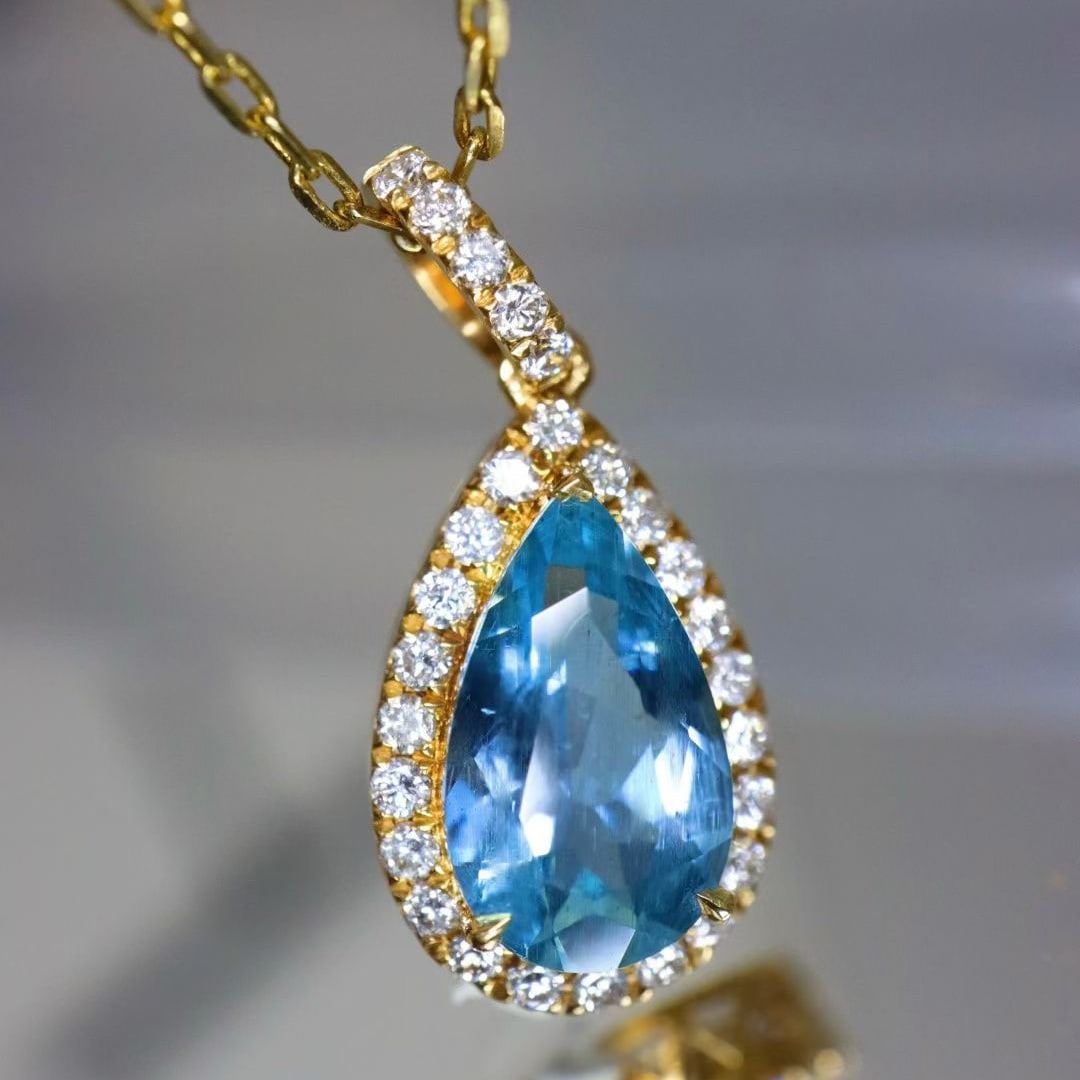14k Gold 1.62 Ctw Natural Aquamarine & Diamond Pendant( Without Chain ): Ref:231017151 // gold content:14k gold // main gemstone:aquamarine // shape:pear // carat weight:1. 35ct // color:santa maria color // treatment:natural // // adjacent gemstone 2 : diamond // shape:ro