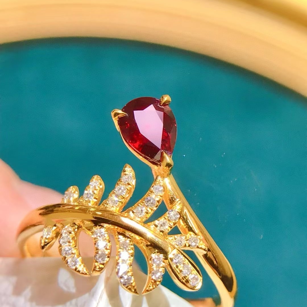 14k Gold 0.62 Ctw Natural Ruby & Diamond Ring: Ref:231017208 // gold content:14k gold // ring size:7. 25us // // main gemstone:ruby // shape:pear // carat weight:0. 5ct // color:pigeonblood red // treatment:natural // // adjacent gemstone 2 : diam