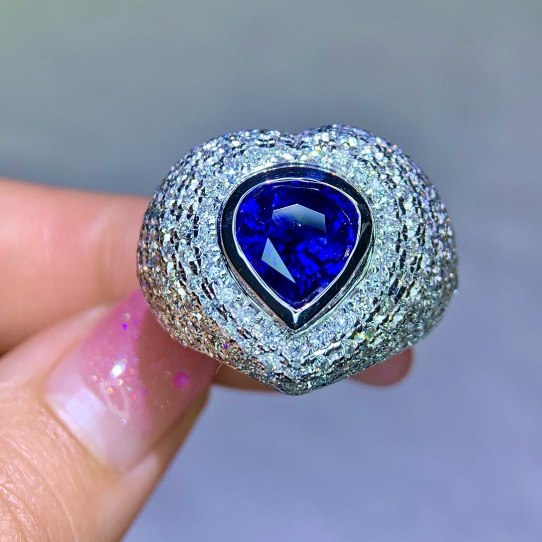 14k Gold 6.58 Ctw Natural Sapphire & Diamond Ring: Ref:231017228 // gold content:14k gold // ring size:7. 25us // // main gemstone:sapphire // shape:pear // carat weight:4. 01ct // color:royal blue // treatment:natural // // adjacent gemstone 2 :
