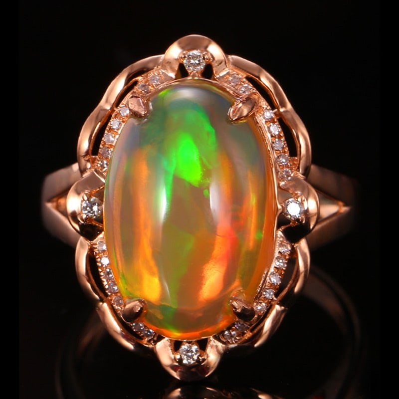 14k Gold 5.11 Ctw Natural Opal & Diamond Ring: Ref:231018029 // gold content:14k gold // ring size:7. 25us // // main gemstone:opal // shape:oval // carat weight:4. 99ct // color:color // treatment:natural // // adjacent gemstone 2 : diamond //
