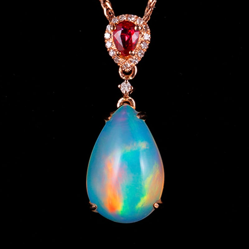 14k Gold 2.84 Ct Natural Opal & Diamond & Ruby Pendant( Without Chain ): Ref:231018030 // gold content:14k gold // main gemstone:opal // shape:pear // carat weight:2. 84ct // color:color // treatment:natural // // adjacent gemstone 2 : diamond // shape:round // clarity