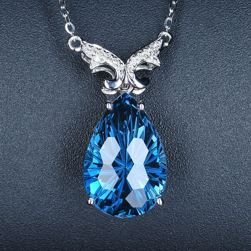 14k Gold 7.87 Ct Natural Topaz & Diamond Necklace: Ref:231018051 // gold content:14k gold // main gemstone:topaz // shape:pear // carat weight:7. 87ct // color:blue // treatment:natural // // adjacent gemstone 2 : diamond // shape:round // clarity