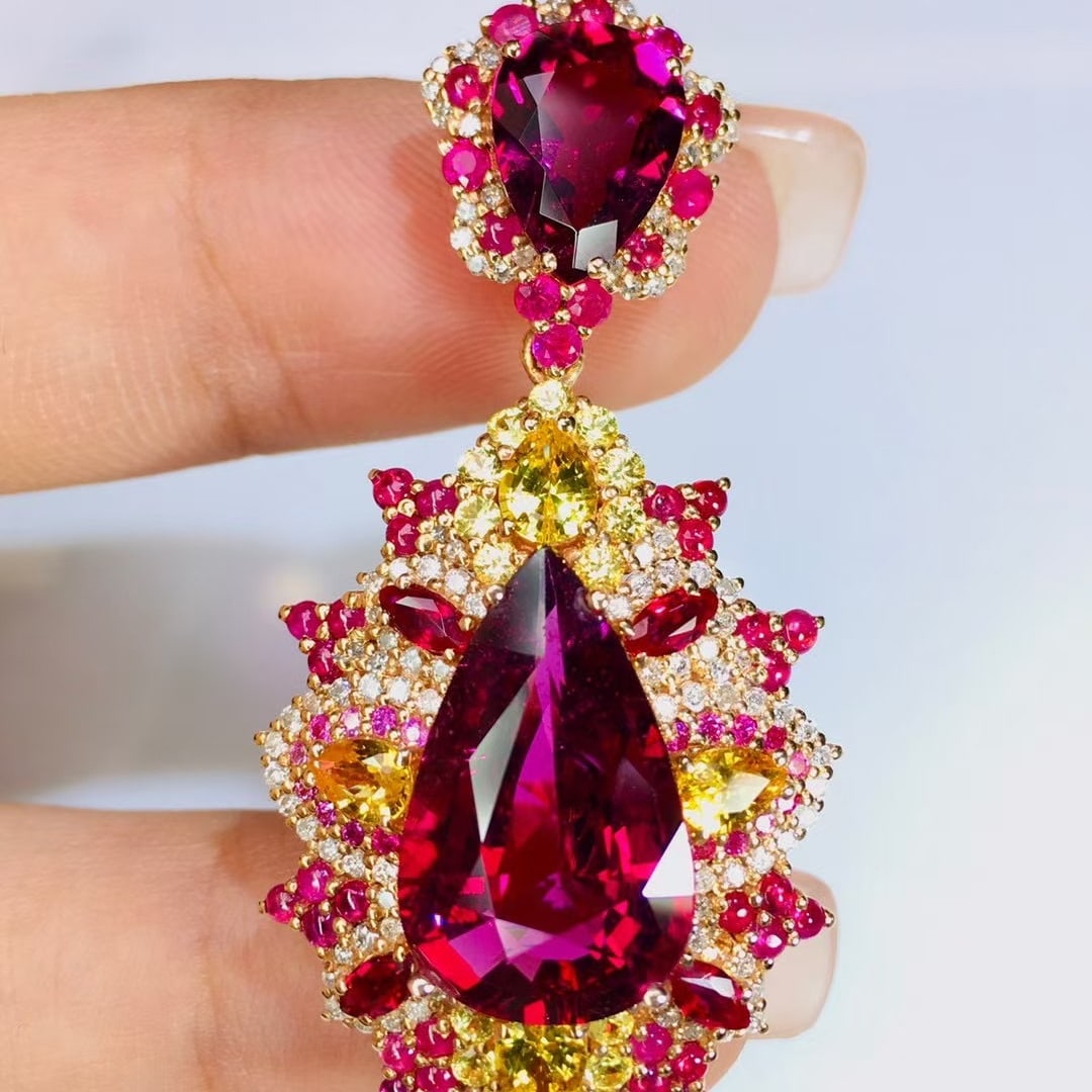 14k Gold 10.1 Ct Natural Tourmaline & Diamond Pendant( Without Chain ): Ref:231018064 // gold content:14k gold // main gemstone:tourmaline // shape:pear // carat weight:10. 1ct // color:red // treatment:natural // // adjacent gemstone 2 : diamond // number of stones:102 /
