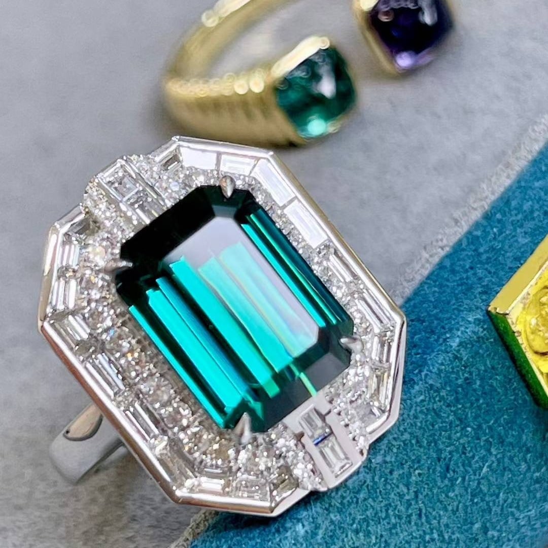 14k Gold 6.6 Ctw Natural Tourmaline & Diamond Ring: Ref:231018065 // gold content:14k gold // ring size:7. 25us // // main gemstone:tourmaline // shape:octagonal // carat weight:5. 5ct // color:bluish green // treatment:natural // // adjacent gemstone