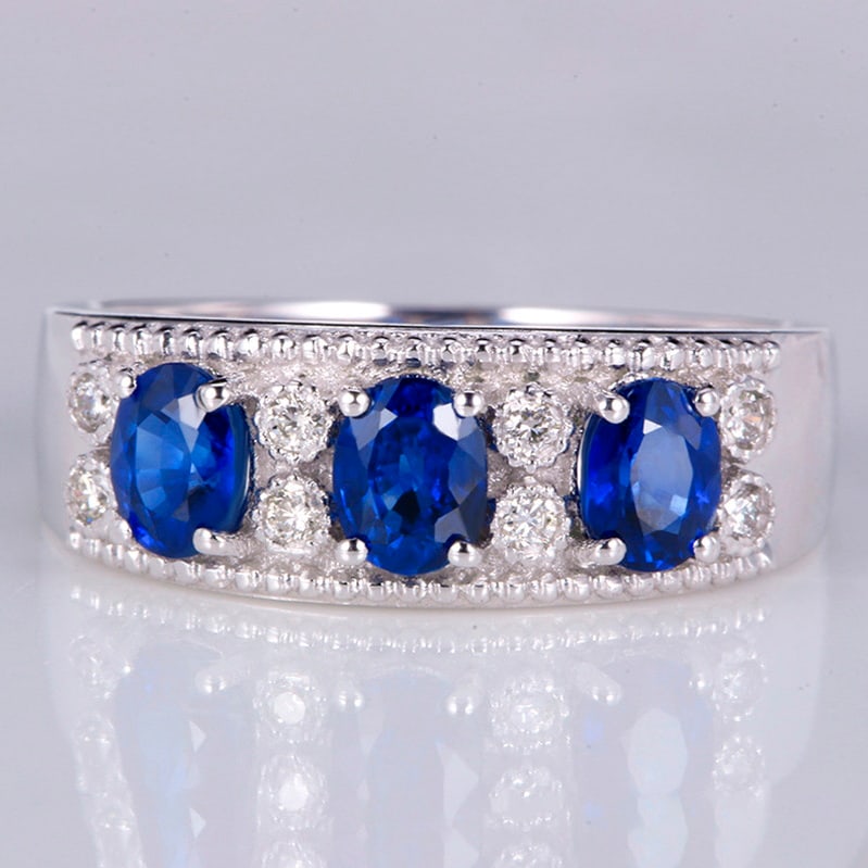 14k Gold 1.39 Ctw Vivid Blue Natural Sapphire & Diamond Ring: Ref:231018095 // gold content:14k gold // ring size:7. 25us // // main gemstone:sapphire // shape:oval // carat weight:1. 31ct // color:vivid blue // treatment:natural // // adjacent gemstone 2 :