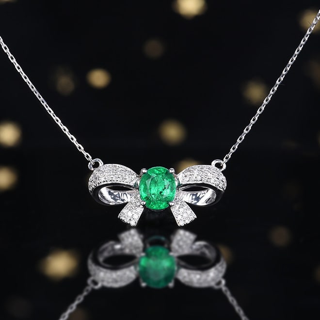 14k Gold 0.93 Ctw Vivid Green Natural Emerald & Diamond Necklace: Ref:231018124 // gold content:14k gold // main gemstone:emerald // shape:oval // carat weight:0. 73ct // color:vivid green // treatment:natural // // adjacent gemstone 2 : diamond // number of stones: