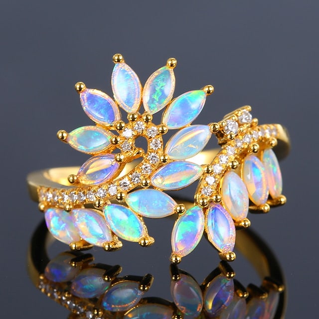 14k Gold 0.91 Ctw Natural Opal & Diamond Ring: Ref:231018127 // gold content:14k gold // ring size:7. 25us // // main gemstone:opal // shape:marquise // carat weight:0. 81ct // color:white // treatment:natural // // adjacent gemstone 2 : diamond