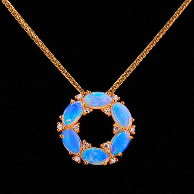 14k Gold 0.97 Ctw Natural Opal & Diamond Pendant( Without Chain ): Ref:231018128 // gold content:14k gold // main gemstone:opal // shape:marquise // carat weight:0. 91ct // color:white // treatment:natural // // adjacent gemstone 2 : diamond // number of stones:12