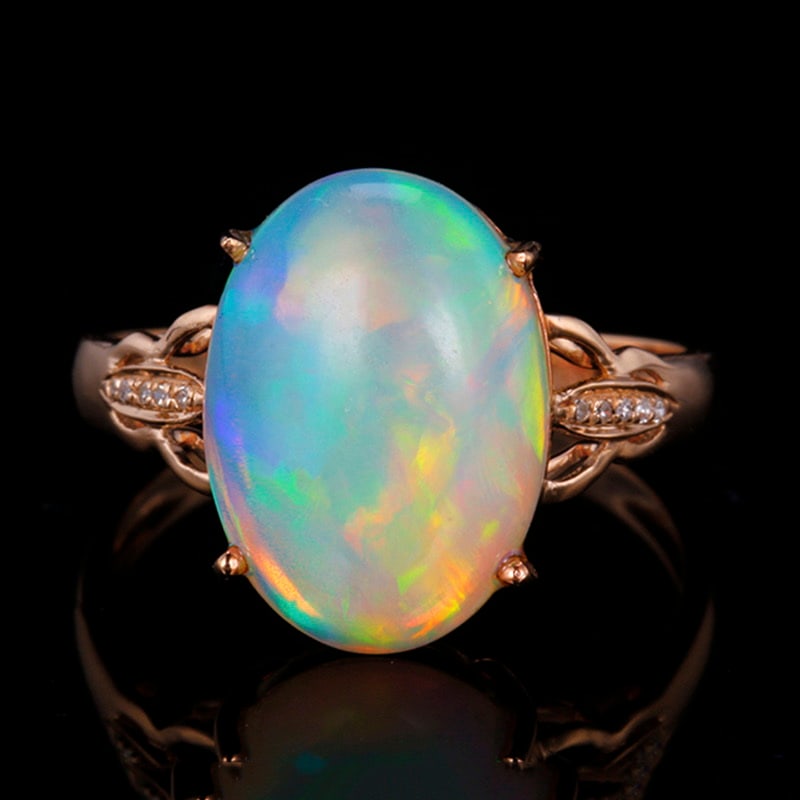 14k Gold 3.64 Ctw Natural Opal & Diamond Ring: Ref:231018129 // gold content:14k gold // ring size:7. 25us // // main gemstone:opal // shape:oval // carat weight:3. 61ct // color:color // treatment:natural // // adjacent gemstone 2 : diamond //