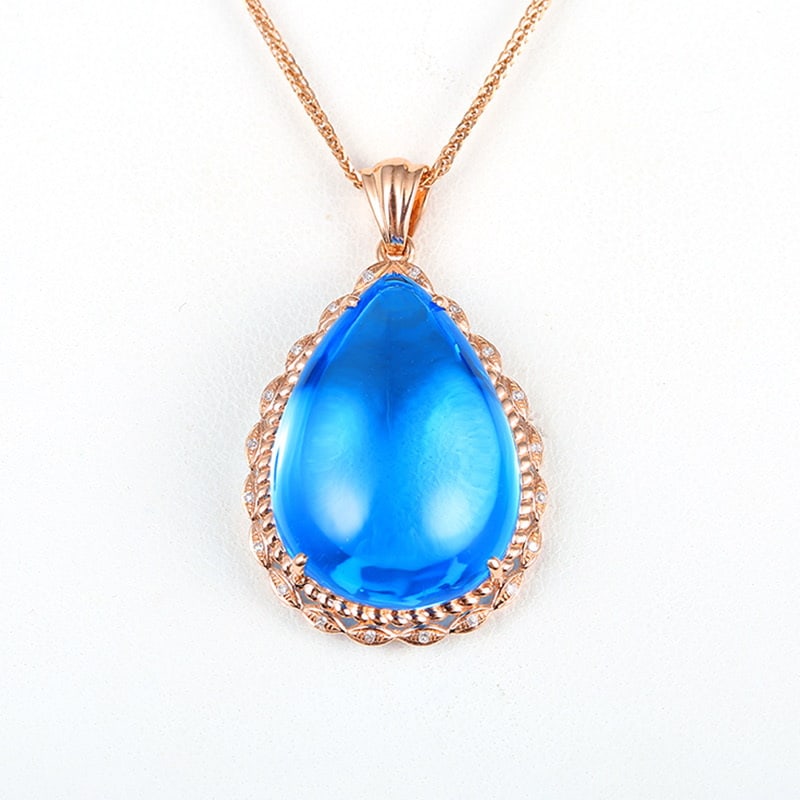 14k Gold 28.84 Ct Natural Topaz & Diamond Pendant( Without Chain ): Ref:231018147 // gold content:14k gold // main gemstone:topaz // shape:pear // carat weight:28. 84ct // color:blue // treatment:natural // // adjacent gemstone 2 : diamond // shape:round // clarity