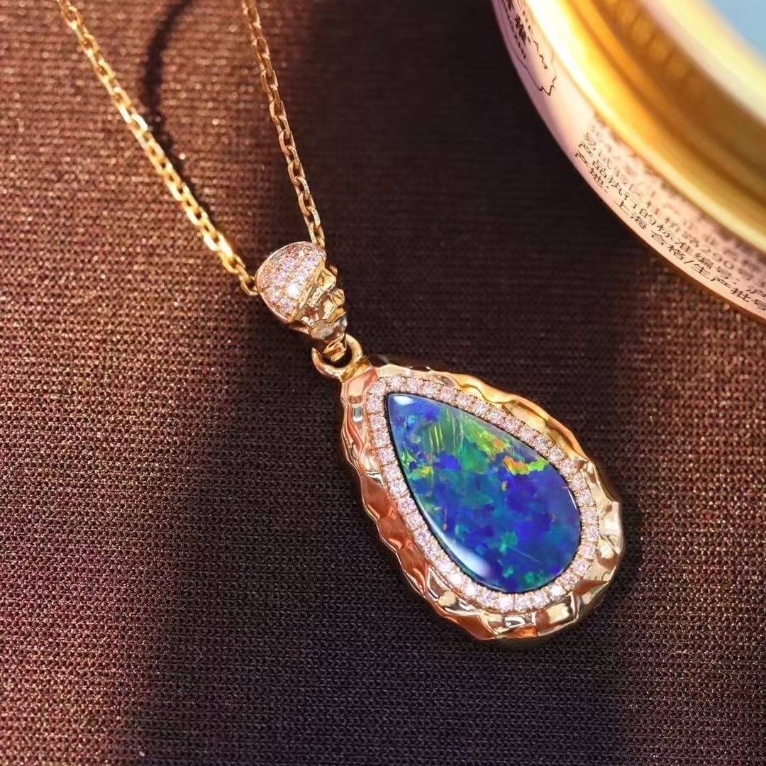 14k Gold 1.96 Ctw Natural Opal & Diamond Pendant( Without Chain ): Ref:231018153 // gold content:14k gold // main gemstone:opal // shape:pear // carat weight:1. 81ct // color:color // treatment:natural // // adjacent gemstone 2 : diamond // shape:round // carat weigh
