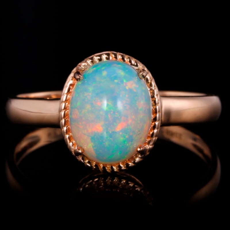 14k Gold 1.88 Ct Natural Opal Ring: Ref:231018195 // gold content:14k gold // ring size:7. 25us // // main gemstone:opal // shape:oval // carat weight:1. 88ct // color:color // treatment:natural // Condition: New Low Estimate: 1100
