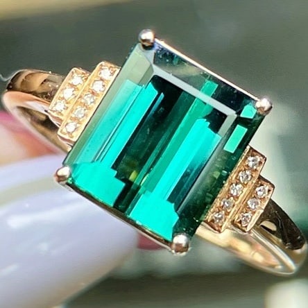 14k Gold 4.1 Ct Natural Tourmaline & Diamond Ring: Ref:231018209 // gold content:14k gold // ring size:7. 25us // // main gemstone:tourmaline // shape:octagonal // carat weight:4. 1ct // color:bluish green // treatment:natural // // adjacent gemstone