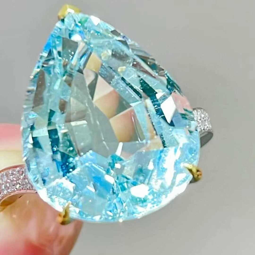 14k Gold 11 Ct Natural Aquamarine & Diamond Ring: Ref:231018243 // gold content:14k gold // ring size:7. 25us // // main gemstone:aquamarine // shape:pear // carat weight:11ct // color:blue // treatment:natural // // adjacent gemstone 2 : diamond //