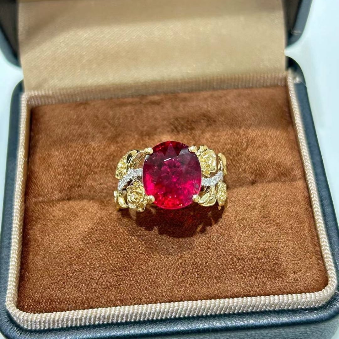 14k Gold 5.73 Ctw Natural Tourmaline & Diamond Ring: Ref:231018314 // gold content:14k gold // ring size:7. 25us // // main gemstone:tourmaline // shape:oval // carat weight:5. 53ct // color:red // treatment:natural // // adjacent gemstone 2 : diamond /