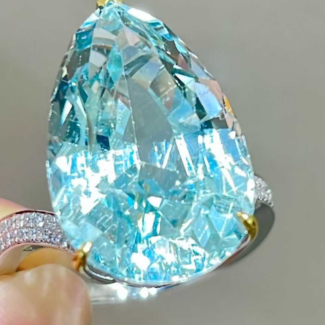 14k Gold 13 Ct Natural Aquamarine & Diamond Ring: Ref:231018359 // gold content:14k gold // ring size:7. 25us // // main gemstone:aquamarine // shape:pear // carat weight:13ct // color:blue // treatment:natural // // adjacent gemstone 2 : diamond // 