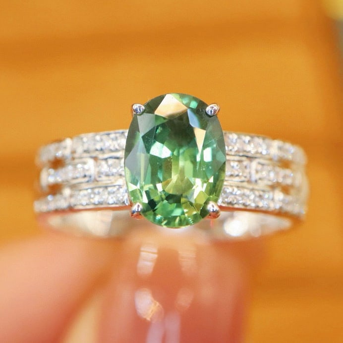 14k Gold 1.59 Ctw Natural Sapphire & Diamond Ring: Ref:231018371 // gold content:14k gold // ring size:7. 25us // // main gemstone:sapphire // shape:oval // carat weight:1. 46ct // color:green // treatment:natural // // adjacent gemstone 2 : diamond