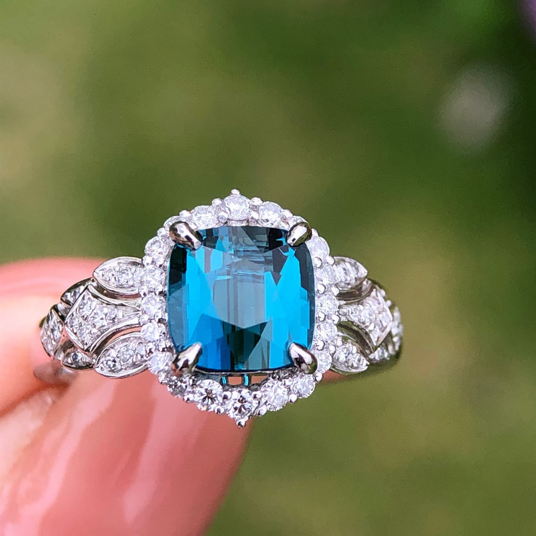 14k Gold 2.56 Ctw Natural Tourmaline & Diamond Ring: Ref:231018381 // gold content:14k gold // ring size:7. 25us // // main gemstone:tourmaline // shape:cushion // carat weight:2ct // color:blue // treatment:natural // // adjacent gemstone 2 : diamond
