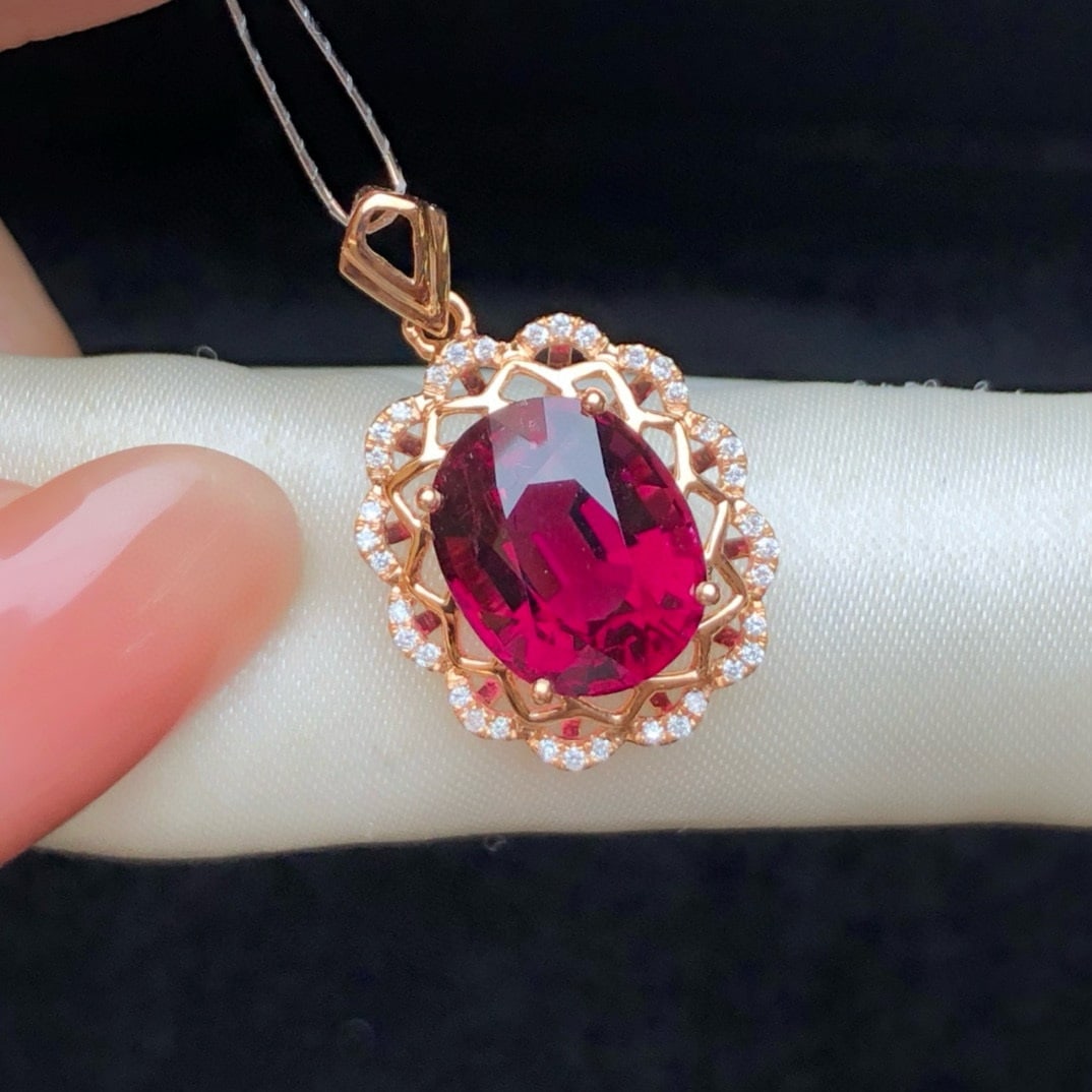 14k Gold 4.22 Ct Natural Tourmaline & Diamond Pendant( Without Chain ): Ref:231018408 // gold content:14k gold // main gemstone:tourmaline // shape:oval // carat weight:4. 22ct // color:red // treatment:natural // // adjacent gemstone 2 : diamond // number of stones:36