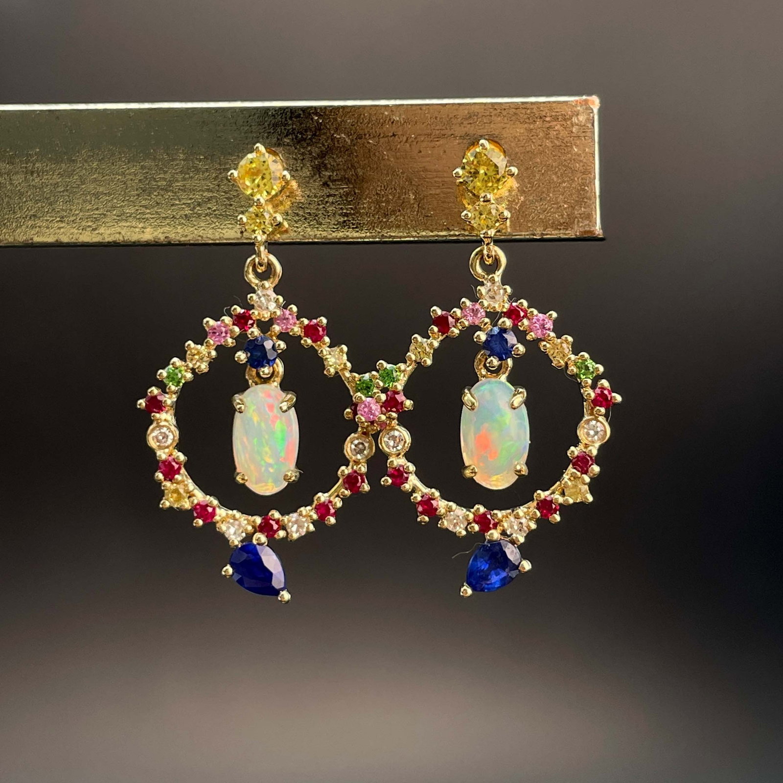 14k Gold 0.4 Ct Natural Opal & Coloured Gemstone Earrings: Ref:231019038 // gold content:14k gold // main gemstone:opal // shape:oval // carat weight:0. 4ct // color:color // treatment:natural // // adjacent gemstone 2 : coloured gemstone // shape:multiply